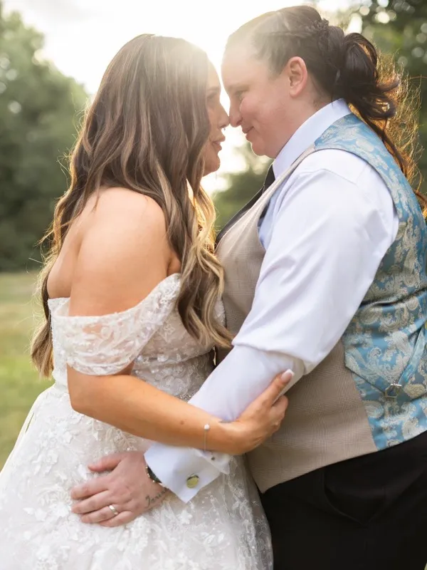 Newlyweds laughing together on their wedding day